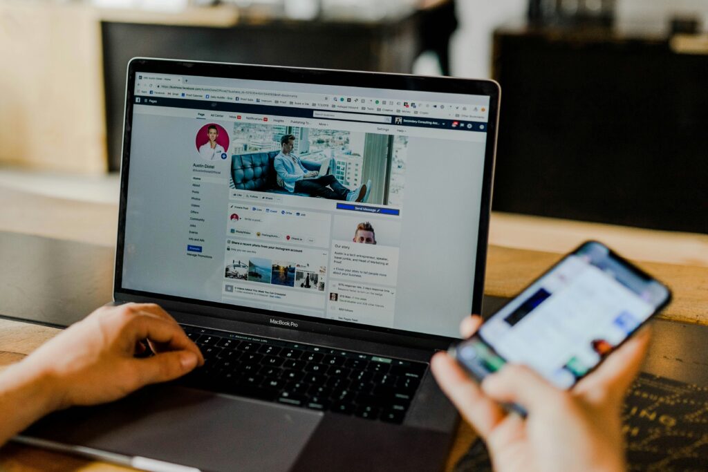 social media marketing A social media marketing expert analyzing facebook analytics on a laptop